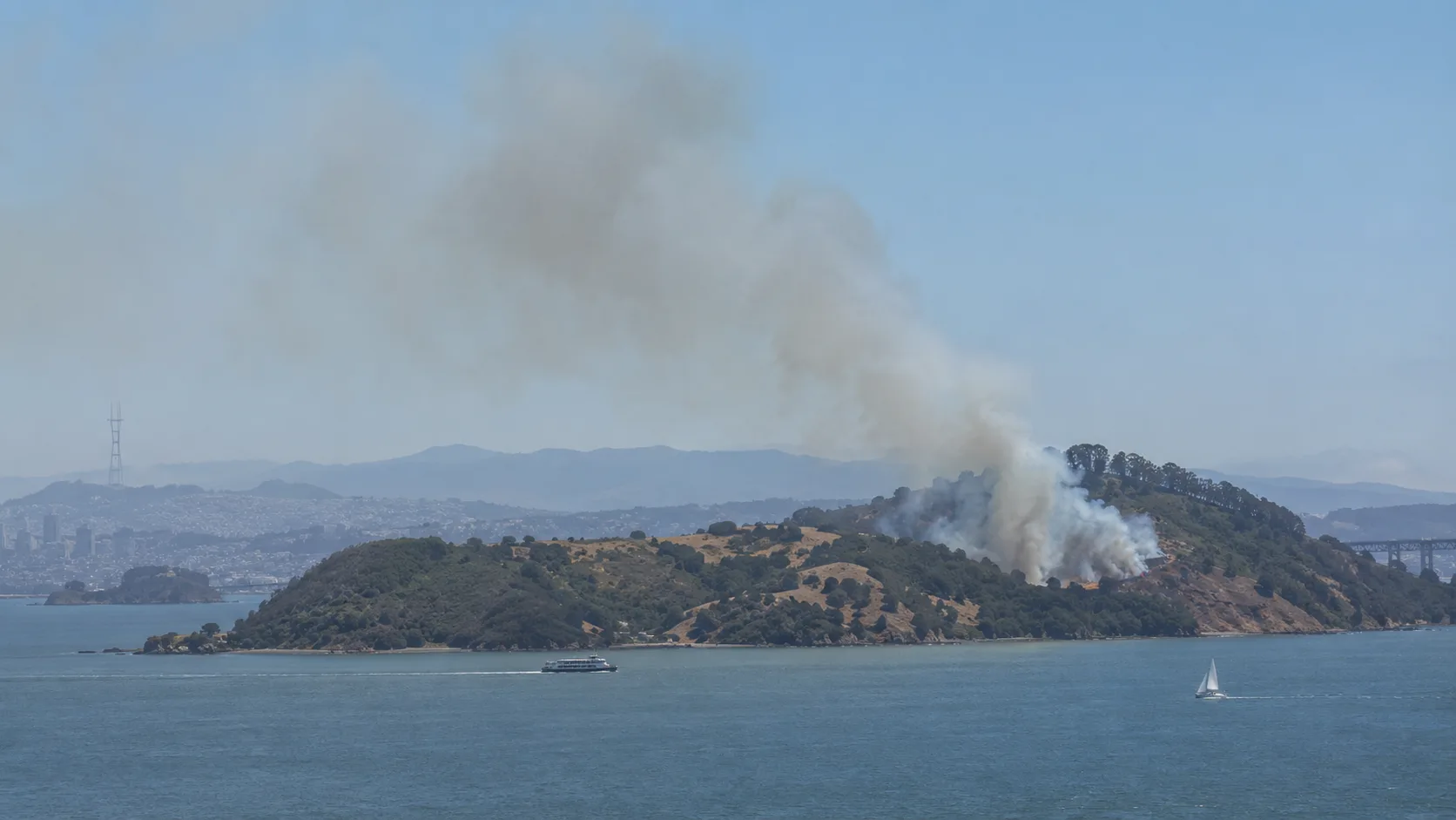 Smoke plume rising from Angel Island across San Francisco Bay during the prescribed burn