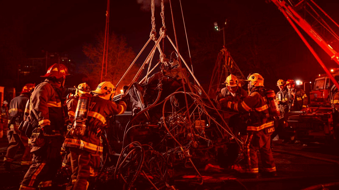 Chicago firefighter battling a fierce garage fire, honoring the sacrifice of a fallen hero.