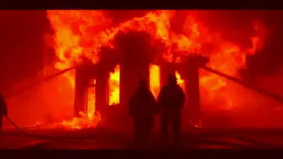 Firefighters battling a fierce house fire in Tarentum, responding to a tragic emergency.