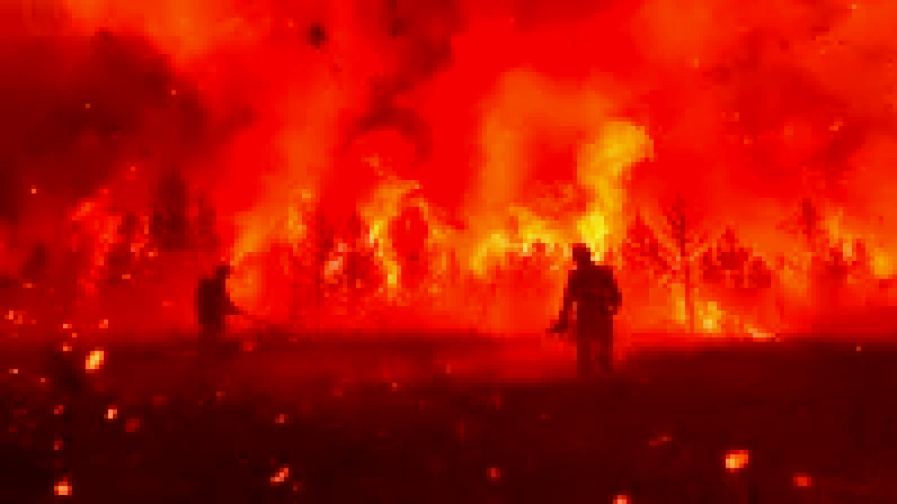 Firefighters battling flames in a historic California gold rush town devastated by wildfire.